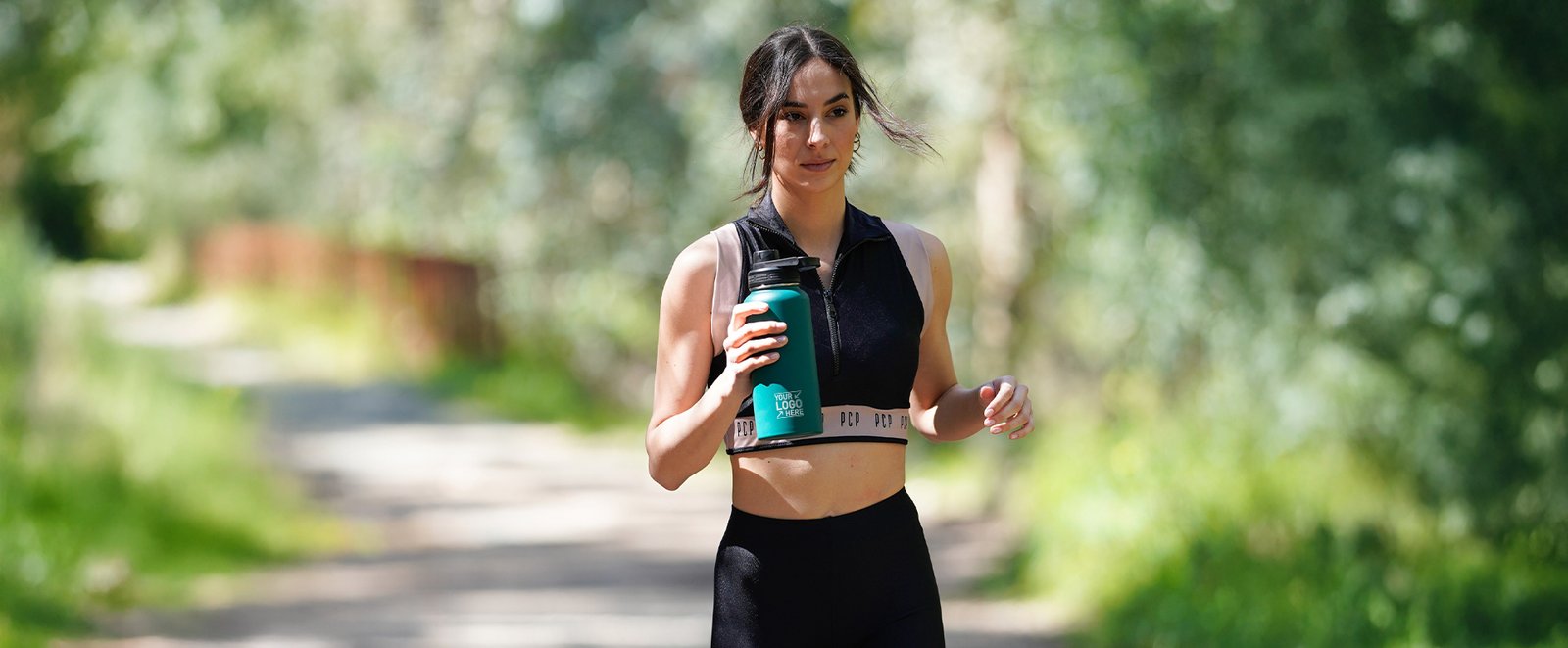 Girl carrying a bottle