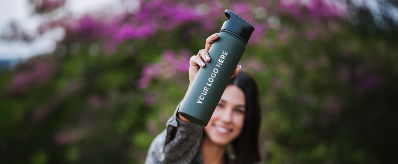 Girl carrying a green bottle